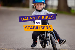 a child wearing a helmet happily riding his strider balance bike