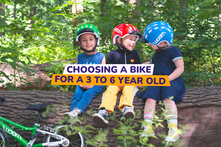 three children sat together with a bike - bike club