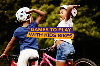 two kids high fiving on bikes - bike club