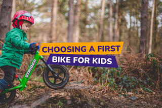 child riding a balance bike in a forest - bike club