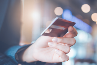 man holding credit card