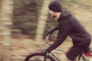 senior mechanic on a bike