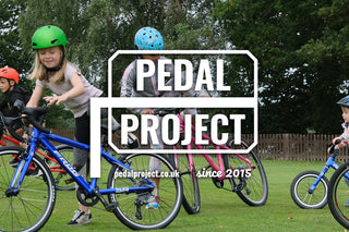 group of kids racing on bikes