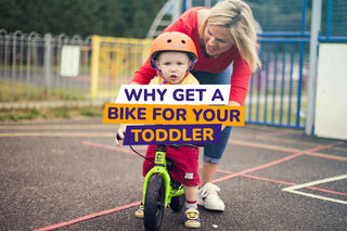 toddler and parent with balance bike