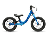 A blue balance bike with black tires, a black saddle, and a black handlebar, shown from a side profile on a white background. The frame features the brand name 'ACADEMY' printed vertically in white.